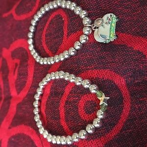 2 Silver Tone Bead, stretch Bracelets with retro Trailer and Star Charms